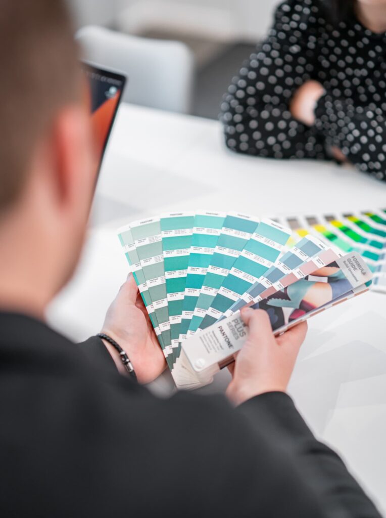 a group of people walking on a sidewalk