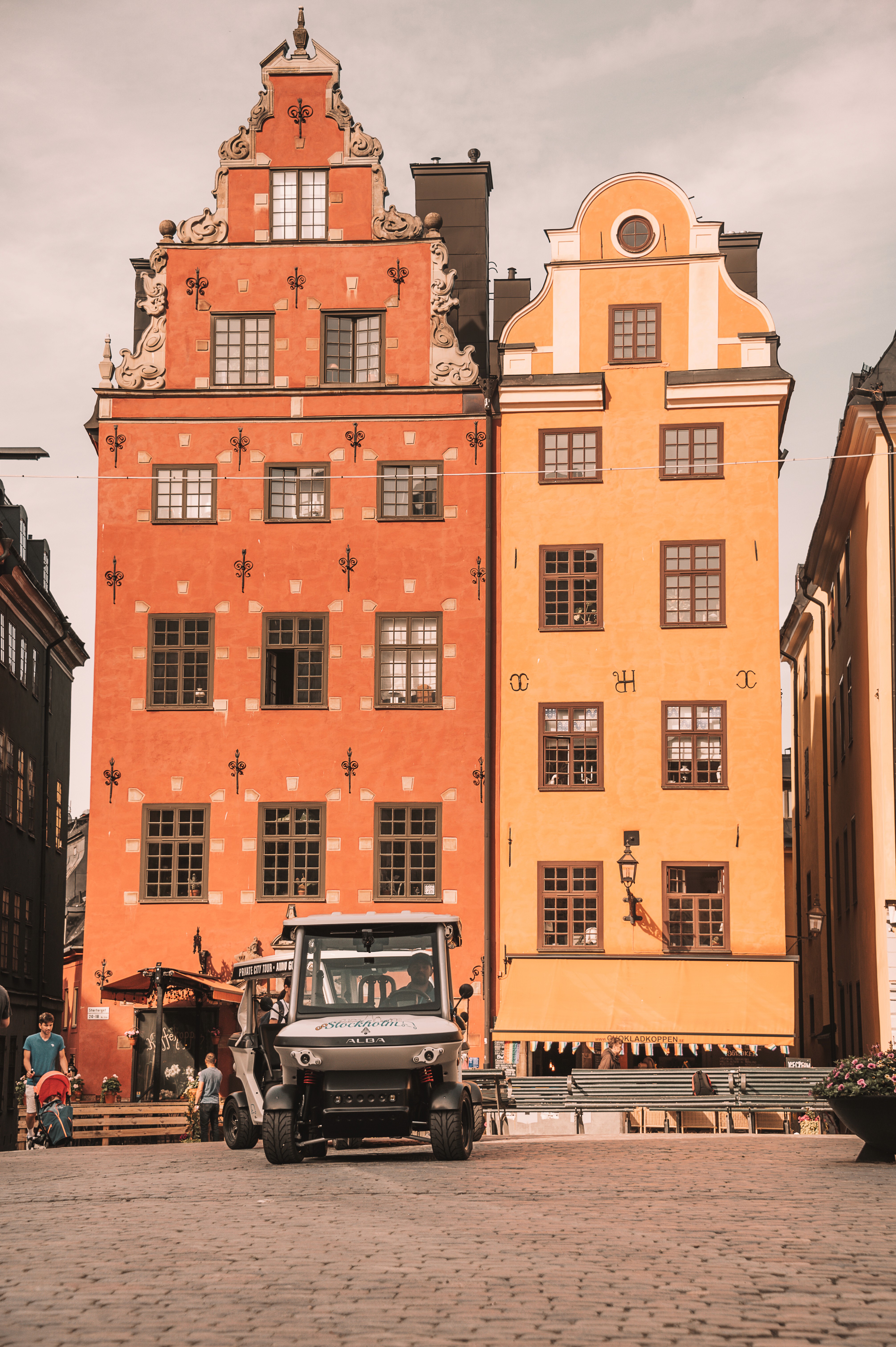 Electric sightseeing cart driving through Gamla Stan old town in Stockholm