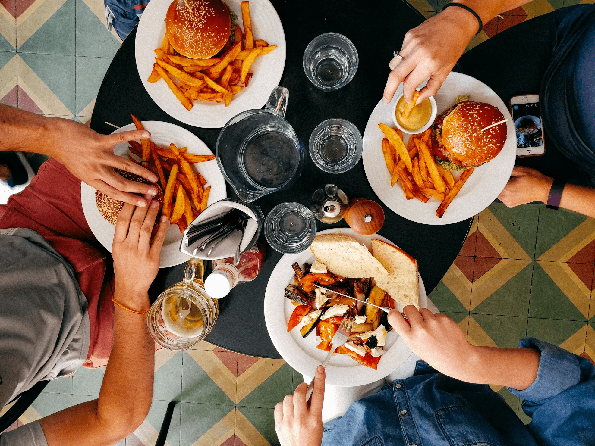 top view of people eating a burger