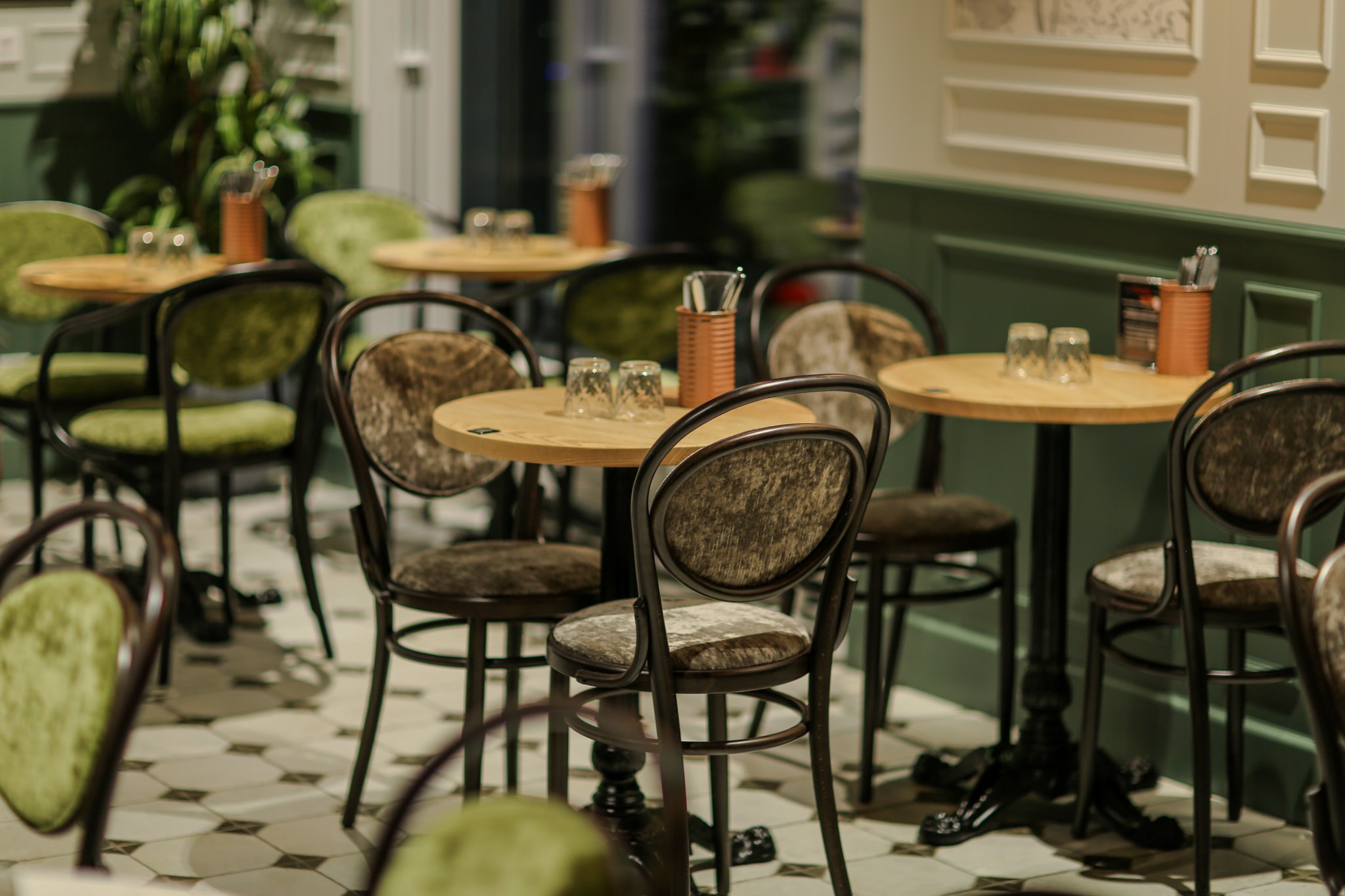 boutique italian restaurant with a green theme, soft and cozy