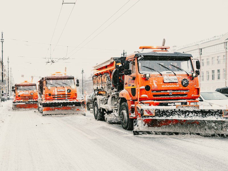 Municipal plow truck clearing a town street
