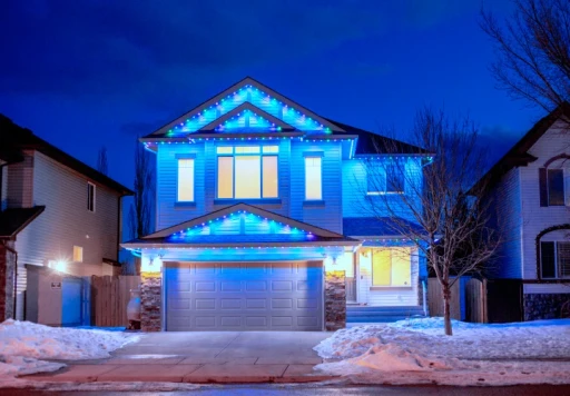Residential Christmas lighting service with red accents and roofline lights in Chester County, PA, creating a bold holiday display.