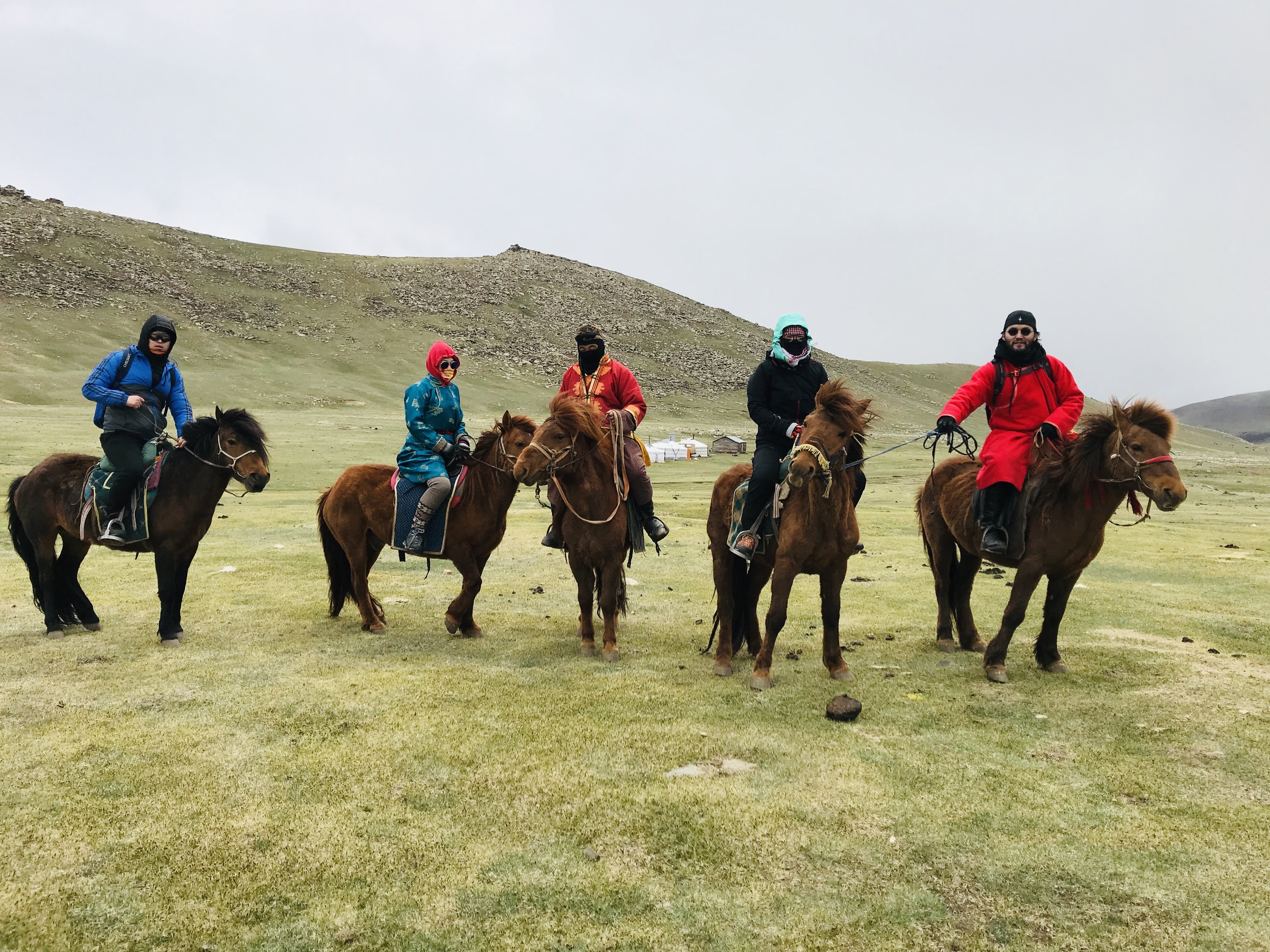 lighted cable bridge near high-rise buildings