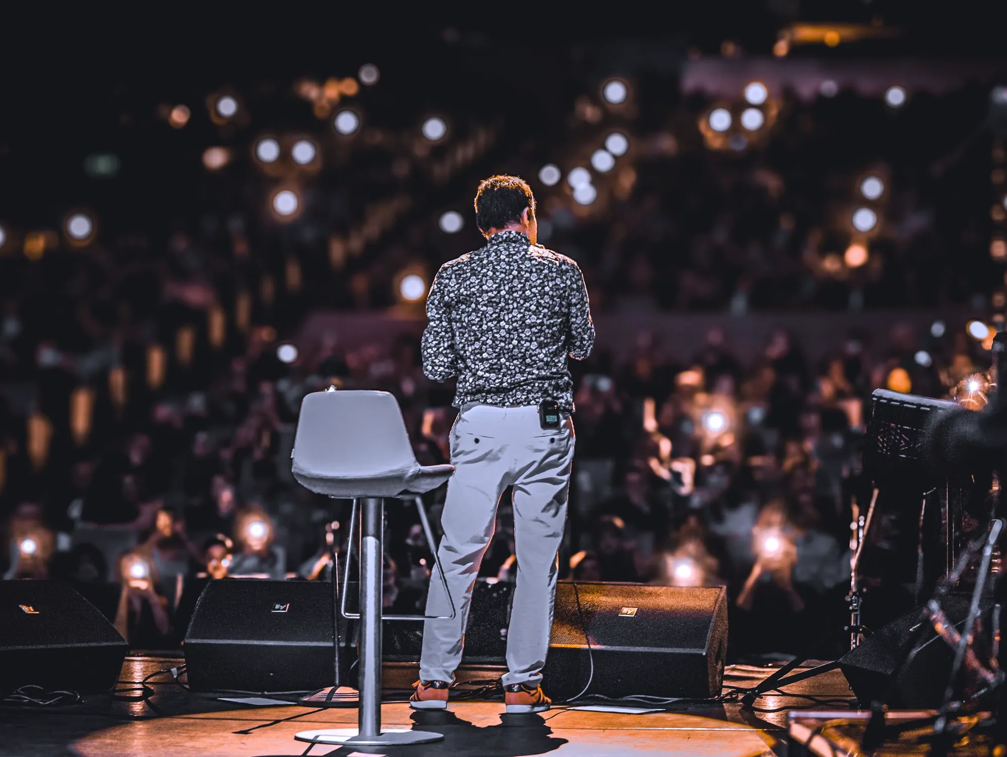 Marcus Reid speaking on stage at Confluence Church