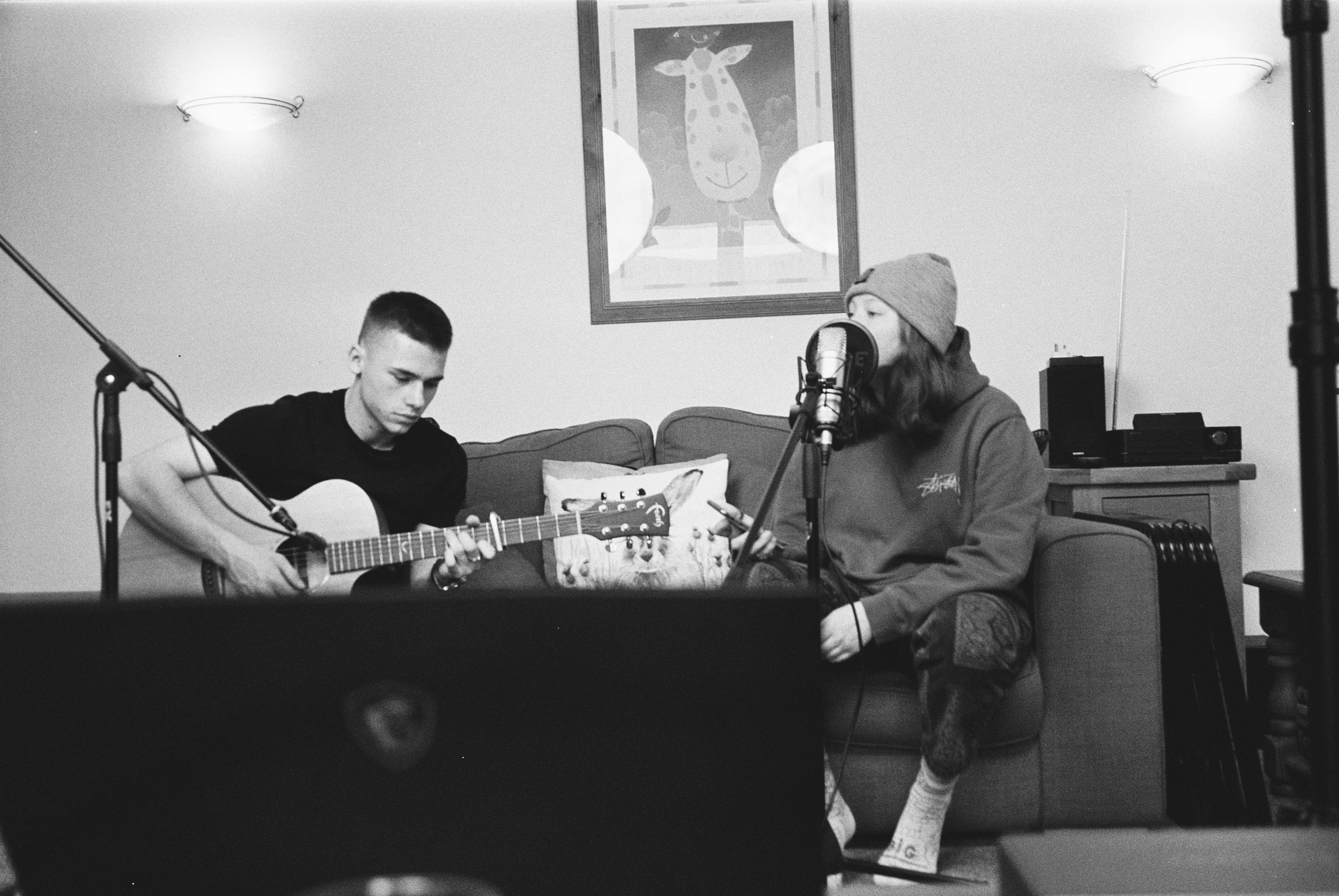 guy playing guitar and girl singing