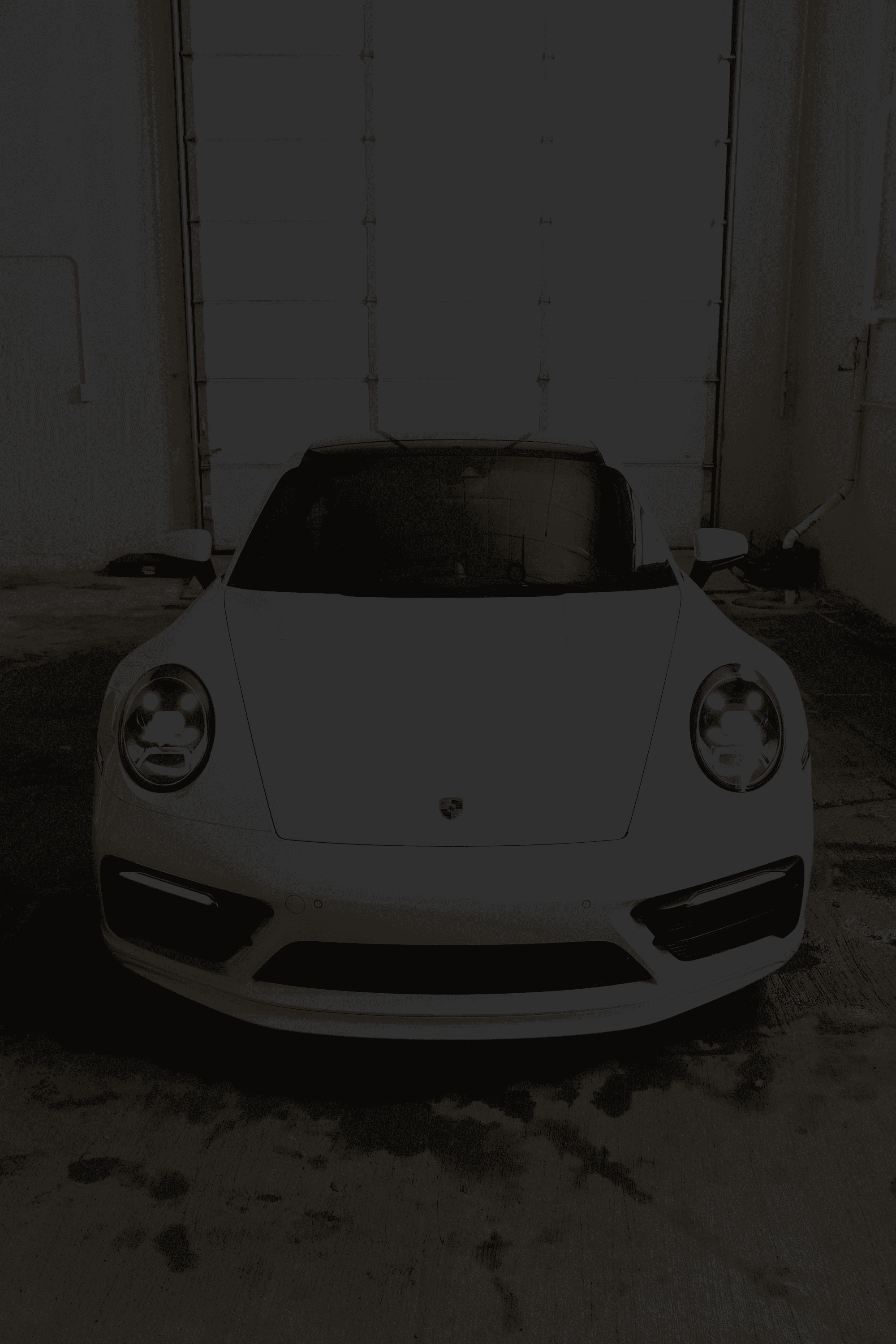 White Porsche getting detailing in Kansas City