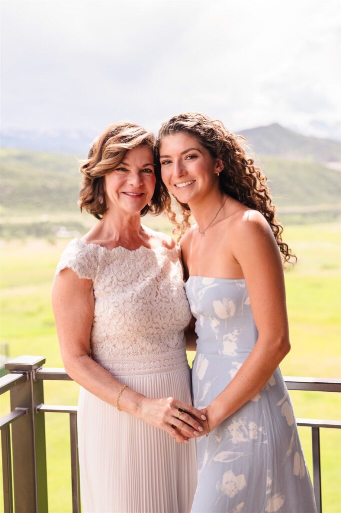 Wedding planner reviewing instant photo delivery setup at an Aspen wedding with zero footprint and no disruption
