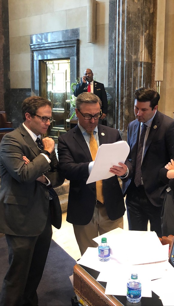 Rick Ward and 2 other men reviewing documents