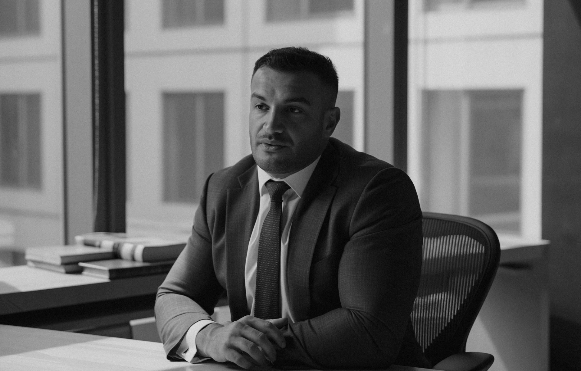 Lawyer sitting in office talking about finance