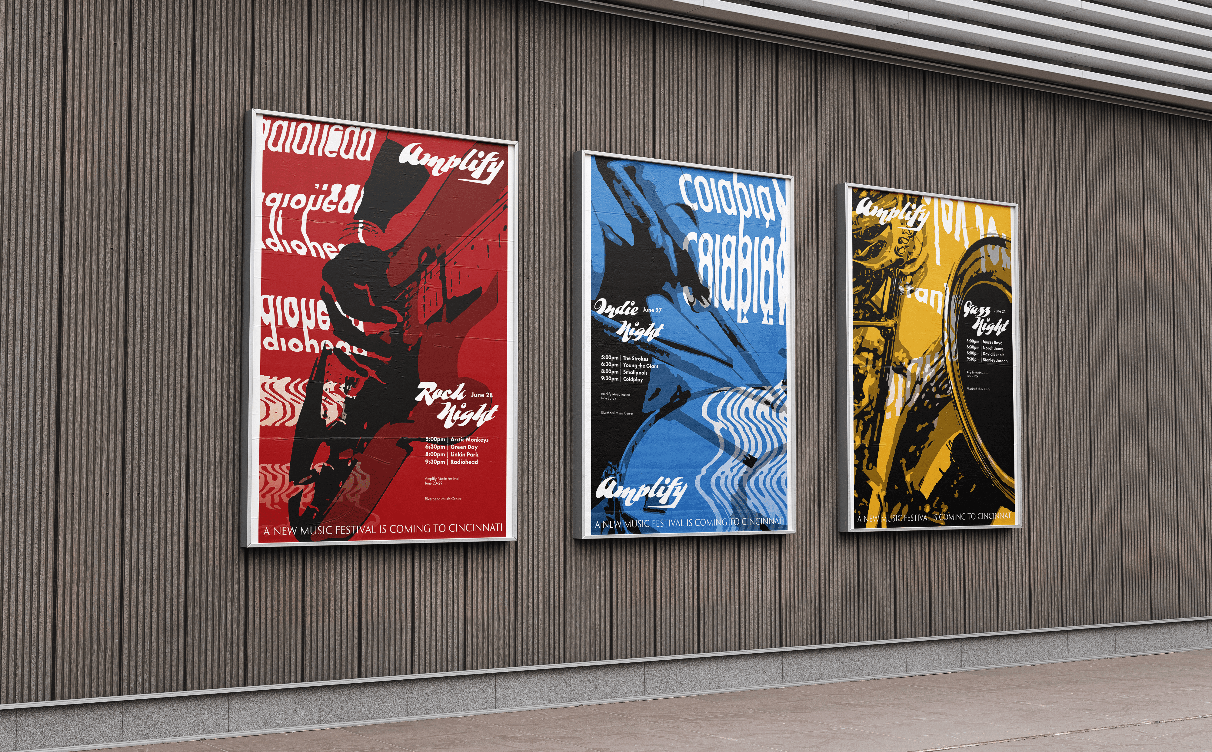 Three of the Amplify posters on a wall