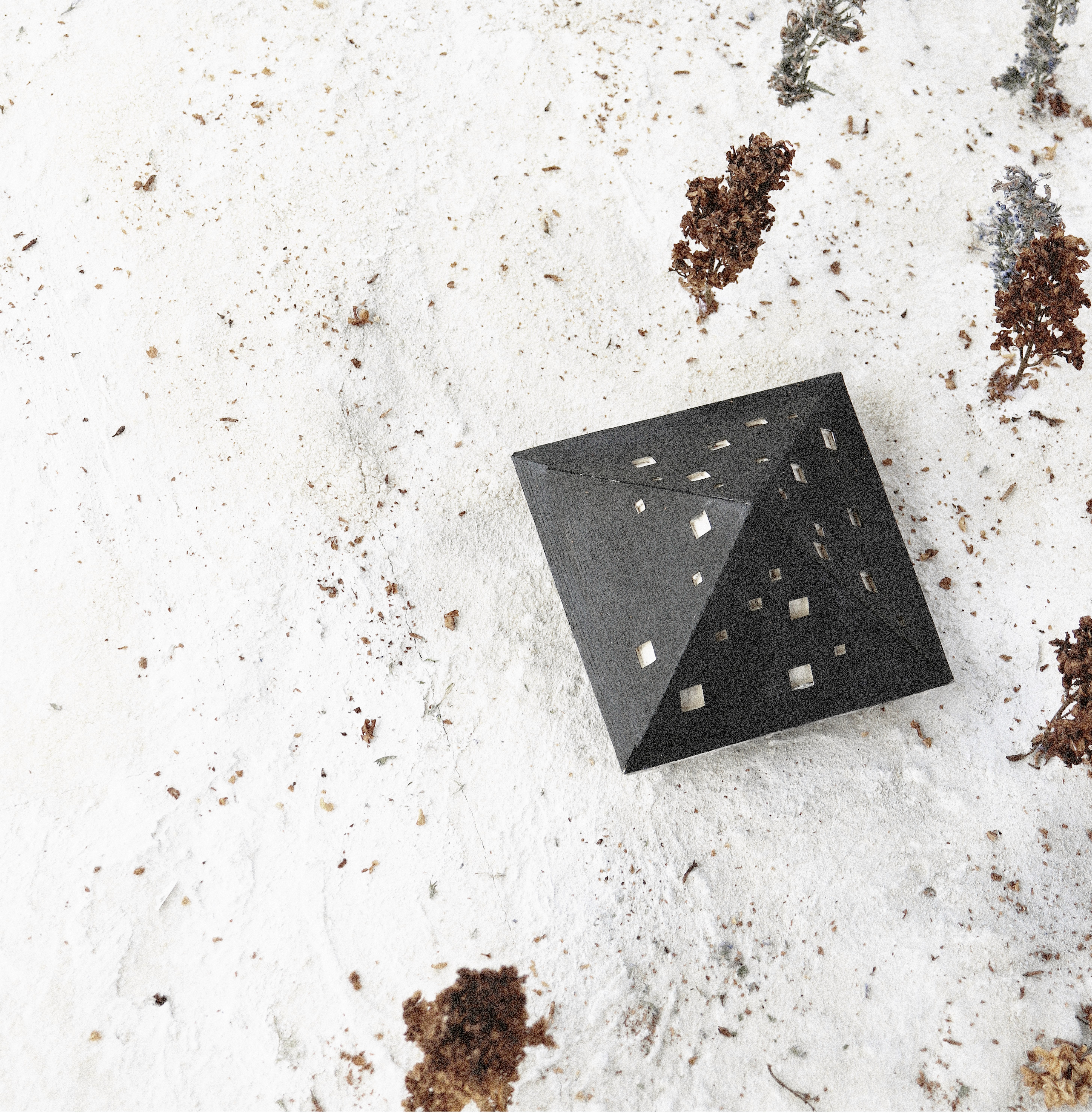 Modern interior with neutral tones, featuring seating areas, wooden floors, and large windows.