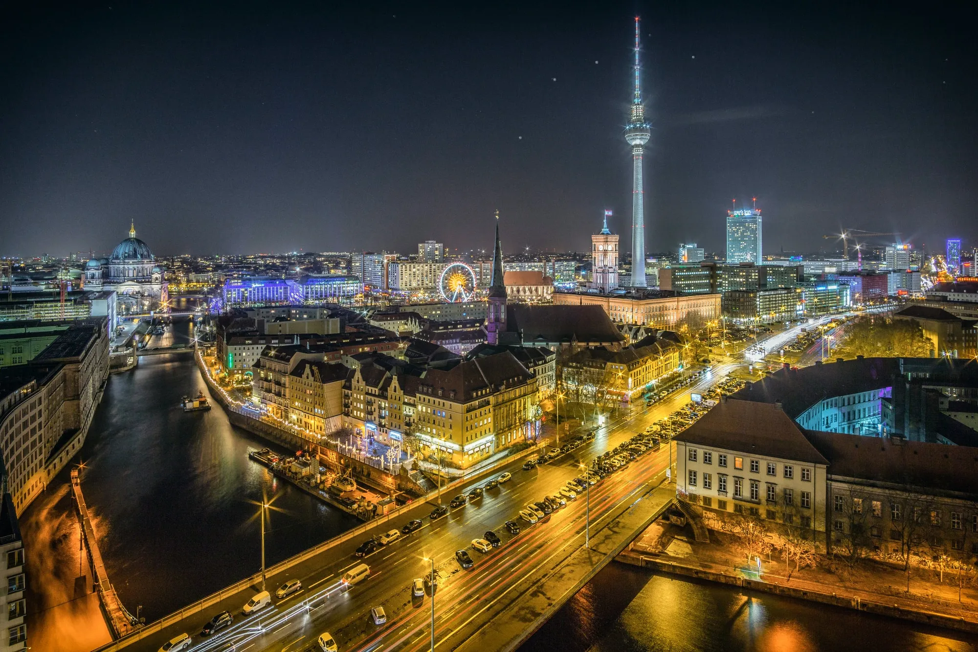 View over the River Spree to Nikolaiviertel and Alexanderplatz at night