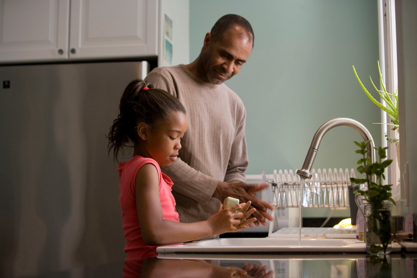 Dad and daughter in kitchen