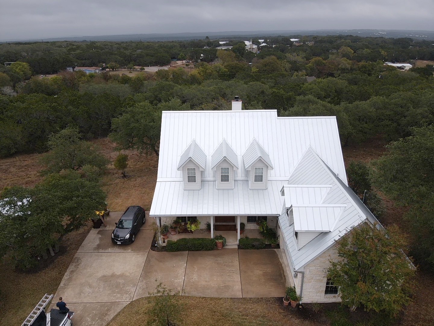 A sleek standing seam 24-gauge mill finish galvalume roof with clean lines and a durable, energy efficient reflective finish.