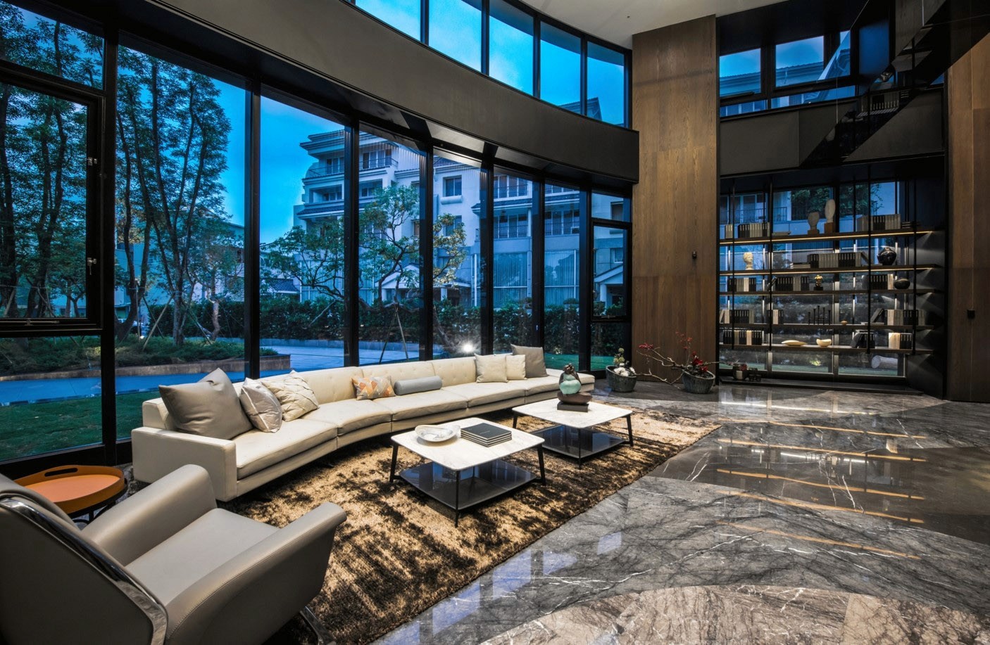Interior seating area with large glazing overlooking landscape.