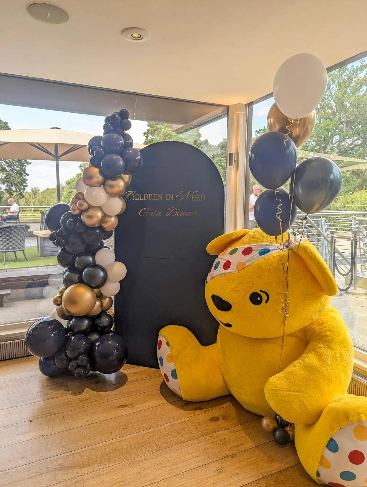 Personalized sailboard display with balloons for an award night