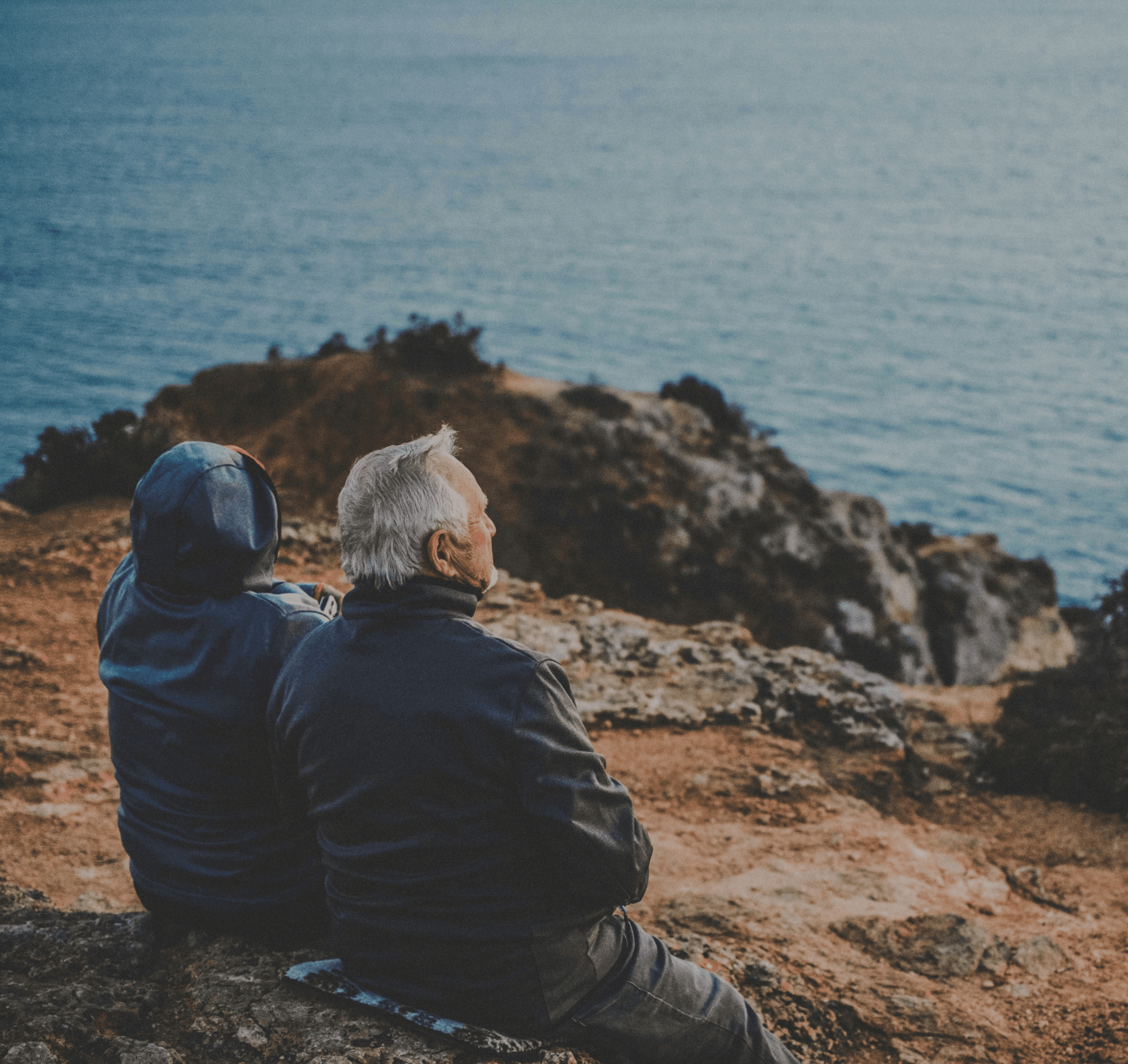 Elderly couple looking at sea