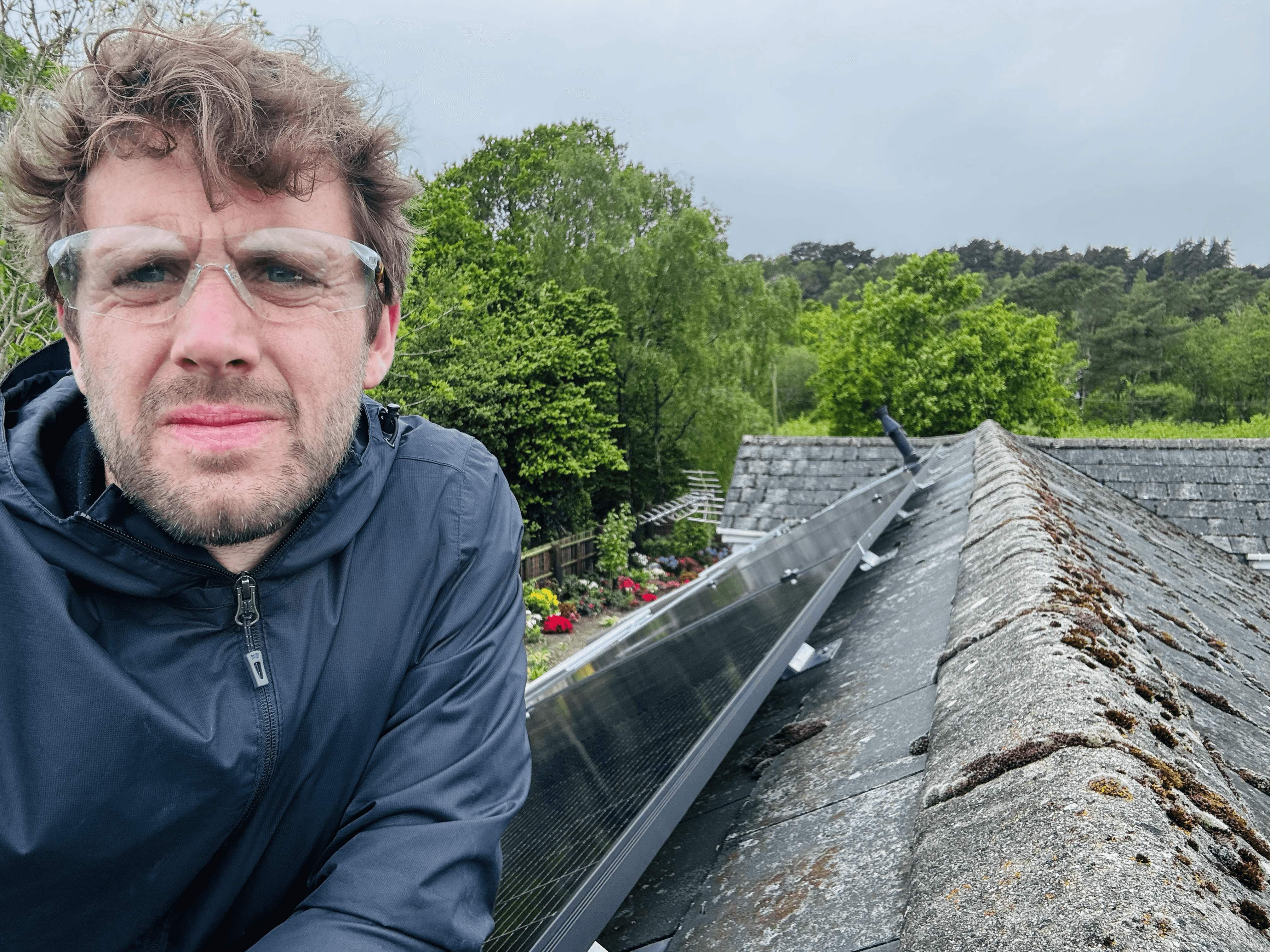An installer on the roof during the solar panel installation at Peter's home