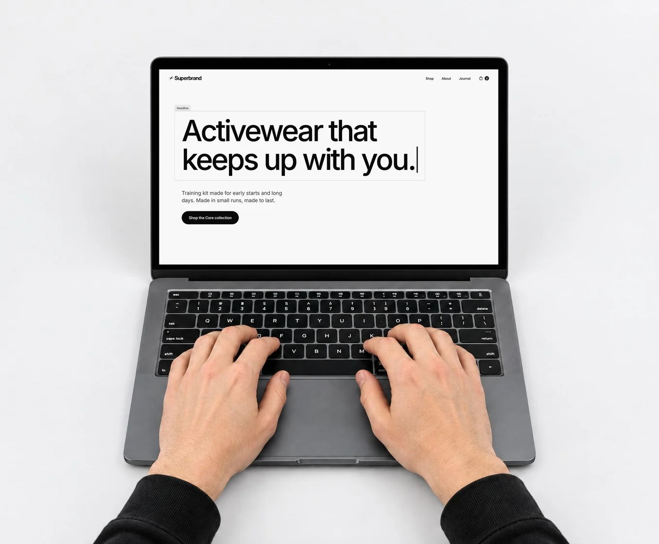 Hands typing on a laptop showing “Activewear that keeps up with you.”