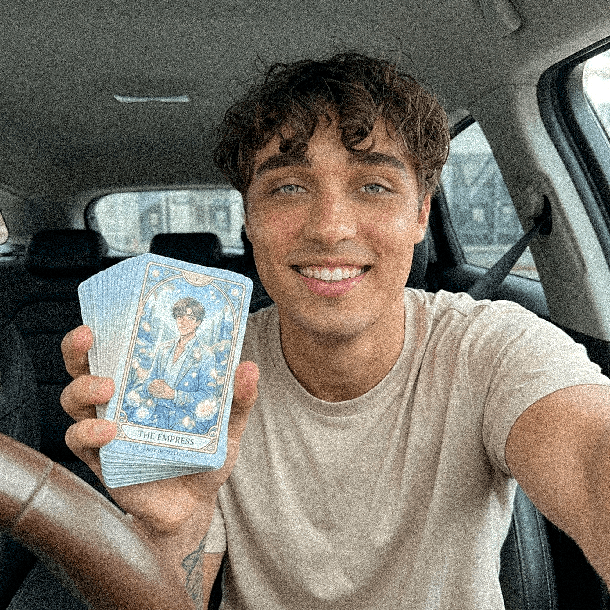 Minimalist installation of three black cubic sculptures with contrasting textures and bands, arranged on a tiled floor in a bright architectural interior.