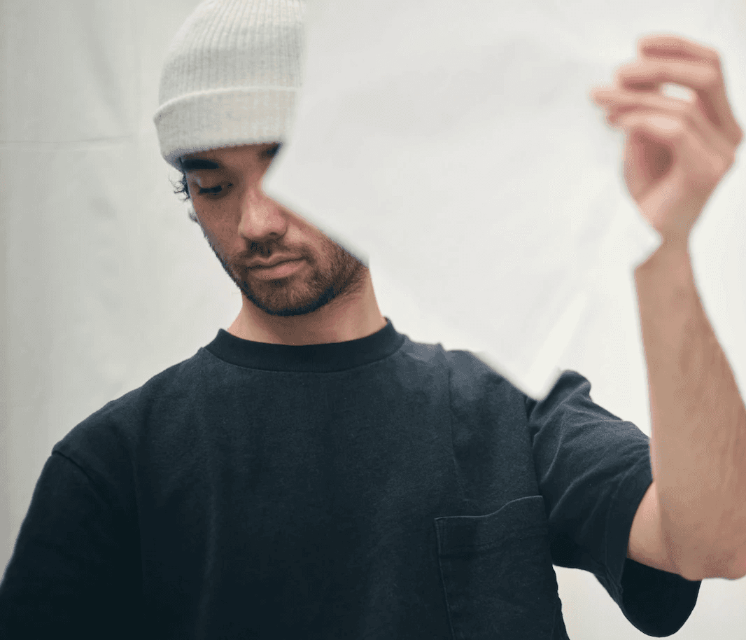 Close up of a man holding design papers