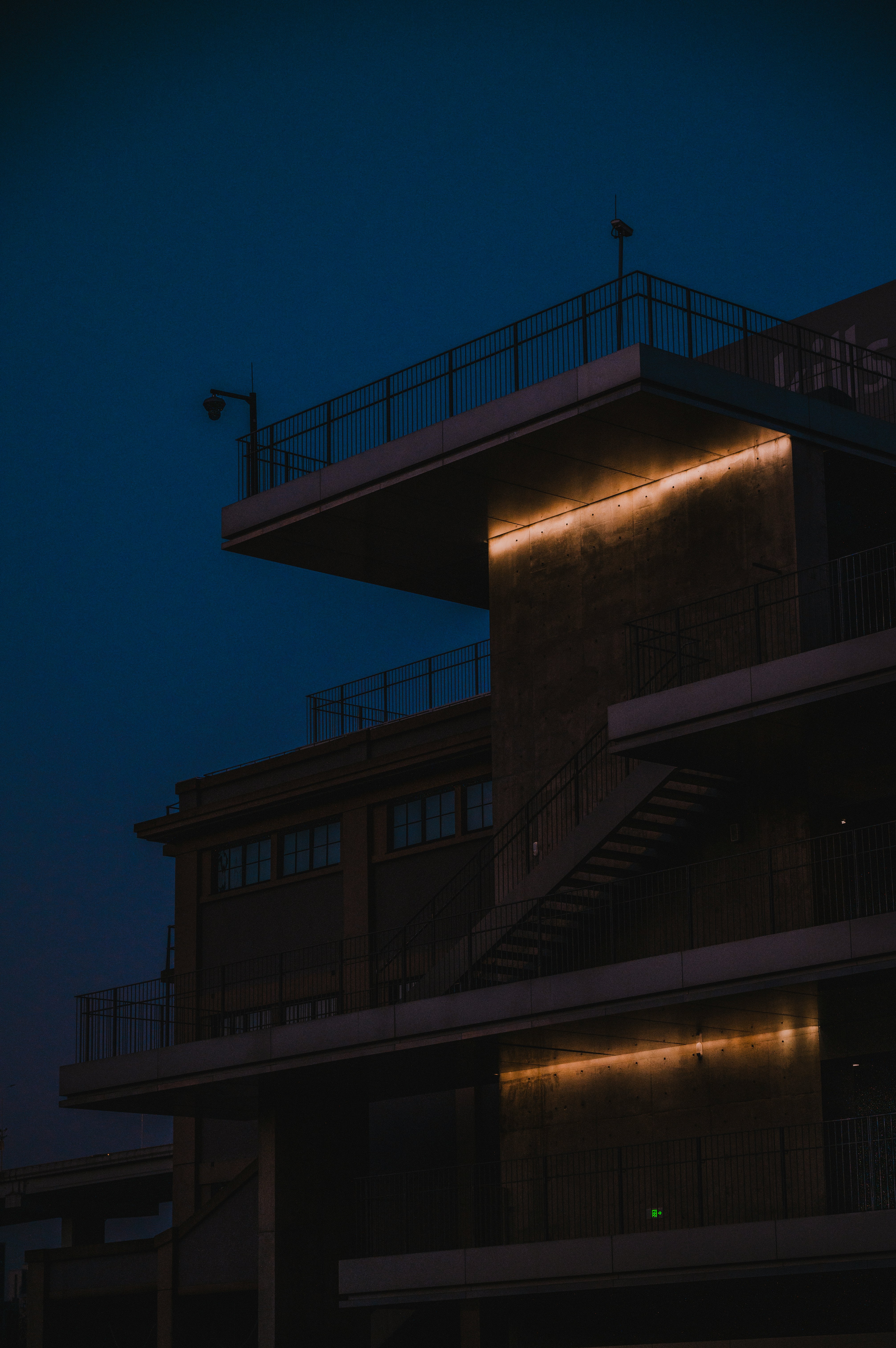 Modern building with illuminated accents at dusk
