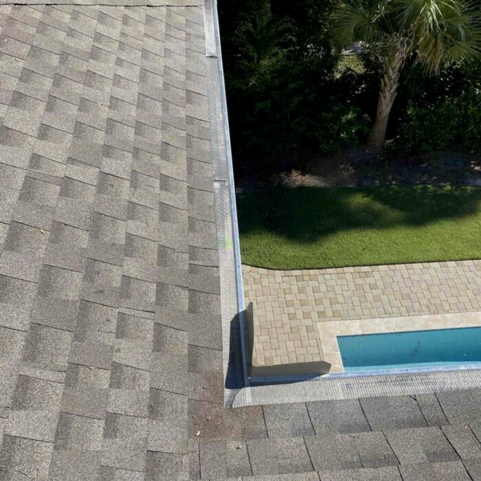 Before and after—gutter cleaned in Hilton Head SC, clear water flow restored after debris removal.