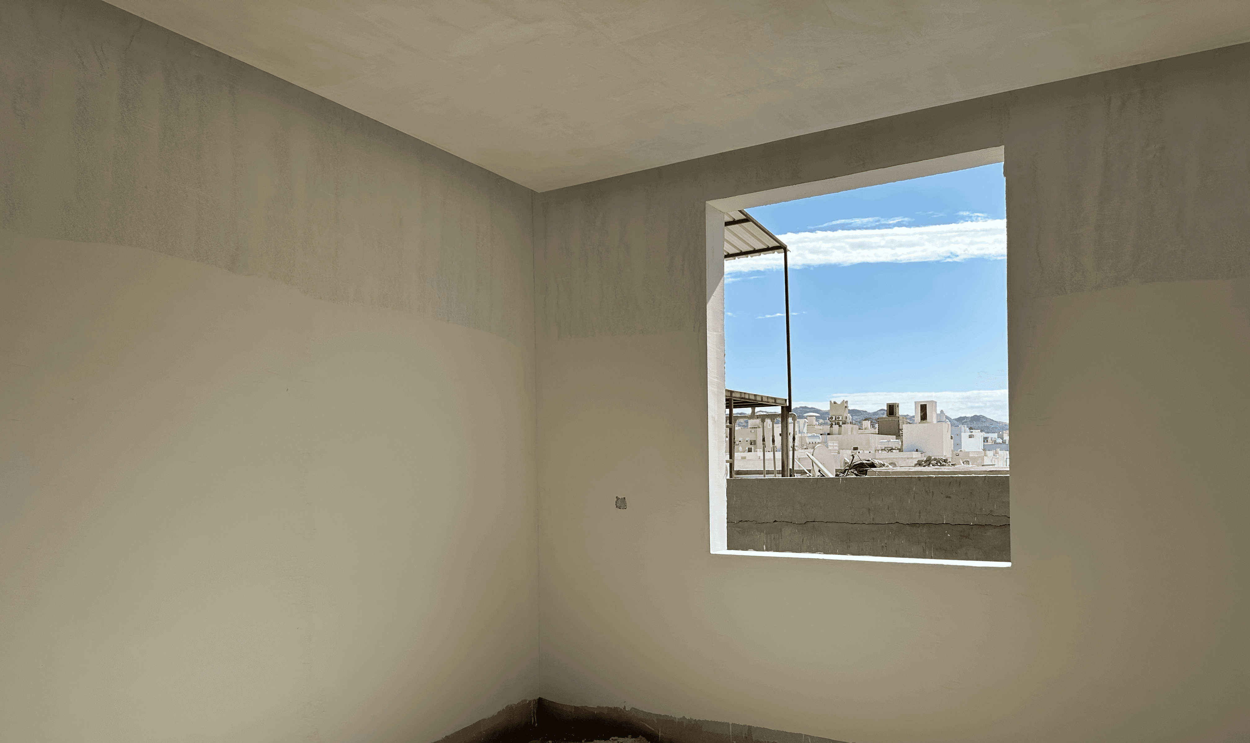 A large room with windows and a ladder