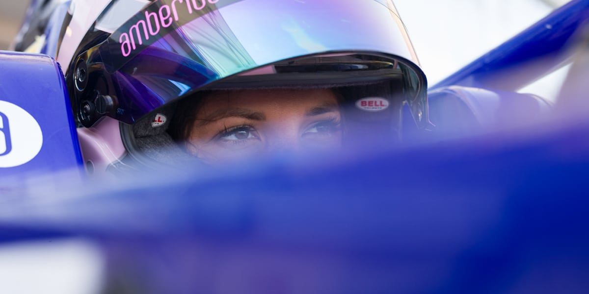 Laptop displaying website on wooden table