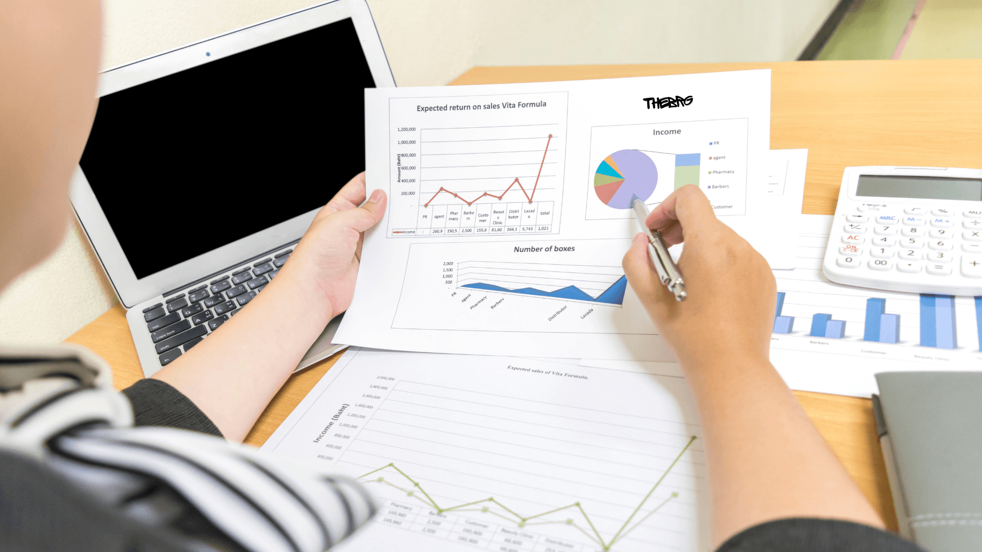 Joyful Asian Businesswoman in a Creative Workspace