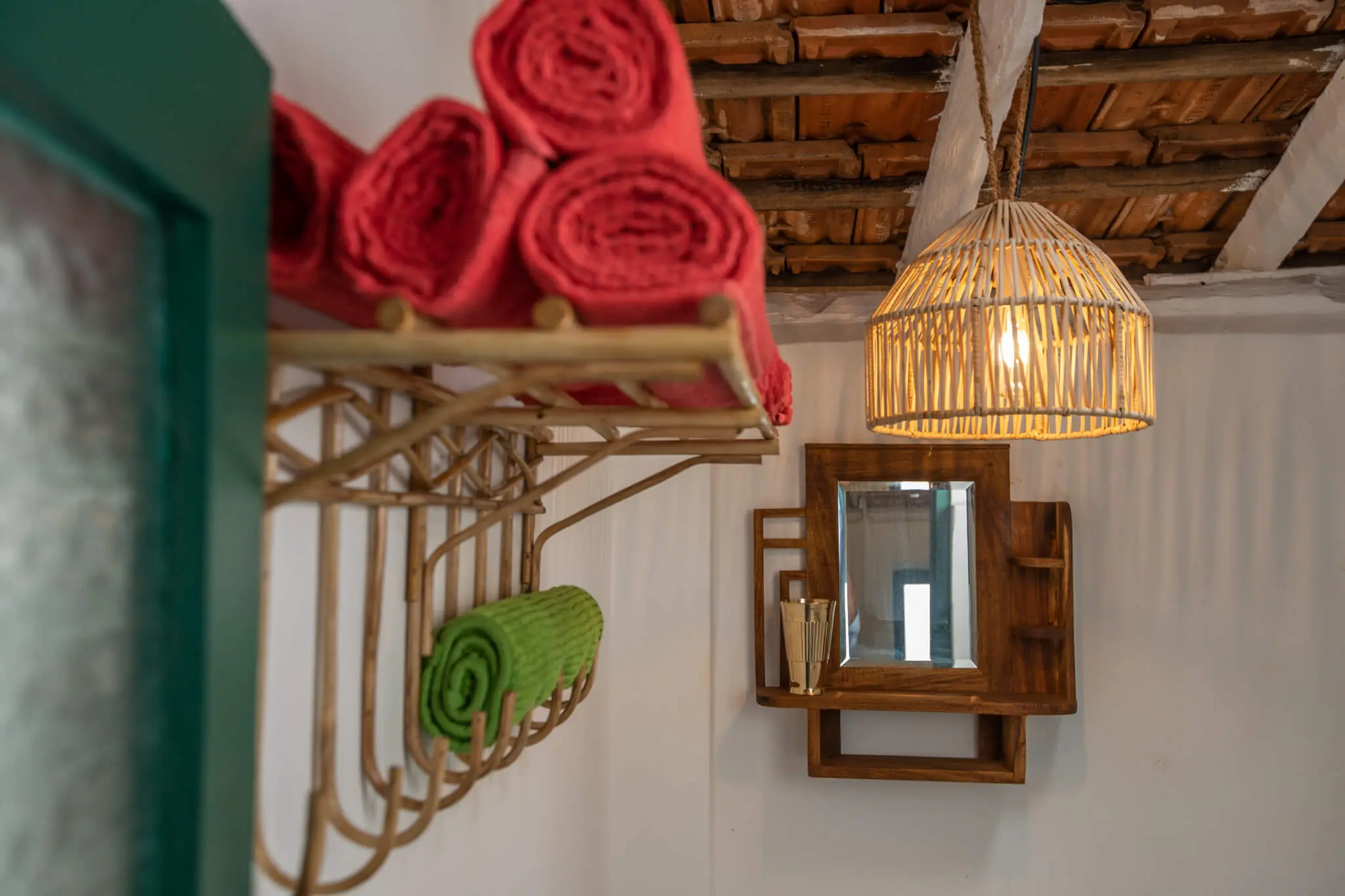 Sea View Family Room at Casa Jaali — red towels and cane pendant detail