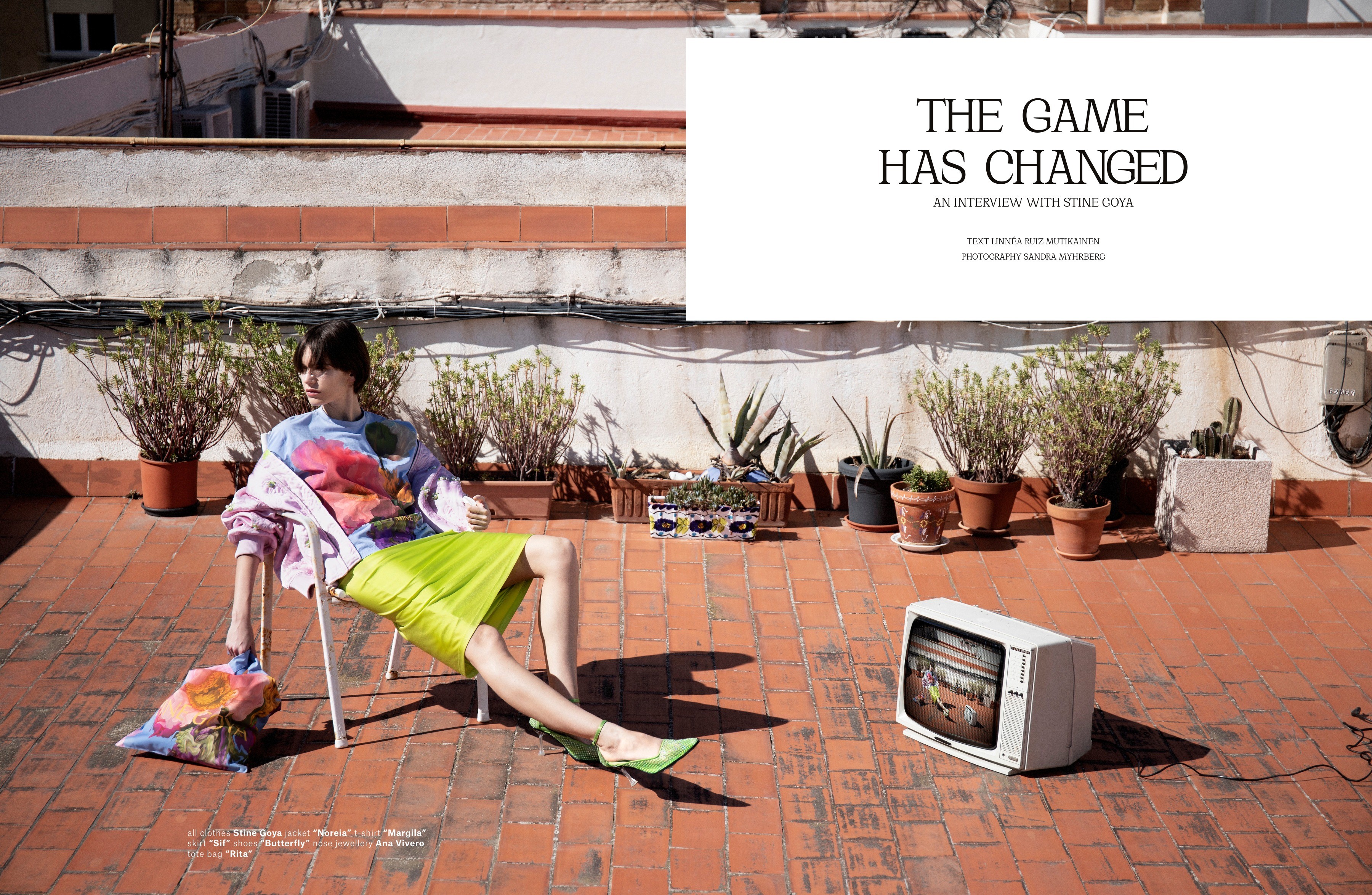 A rooftop fashion scene with a floating white title panel.
