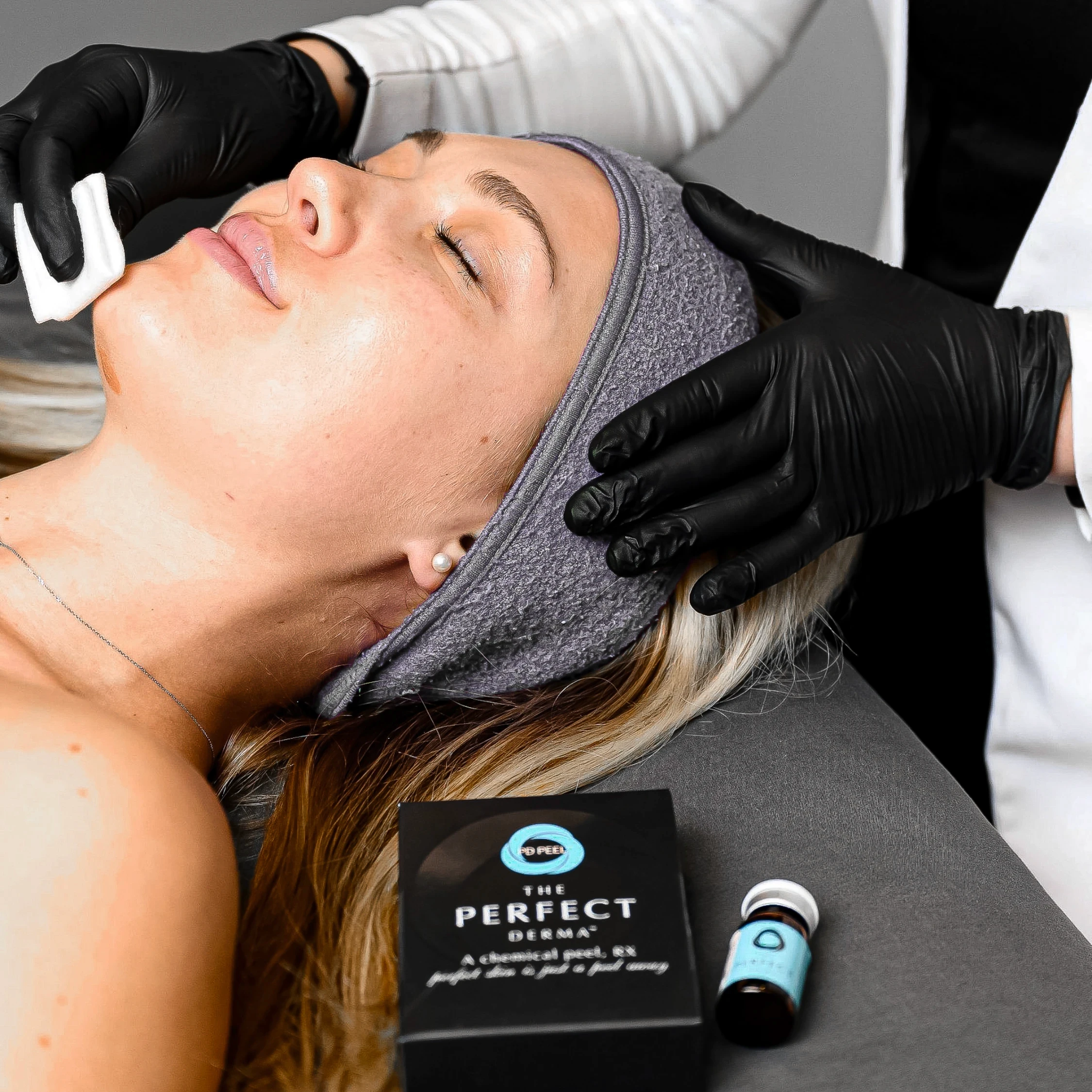 Jamie Ruiz performing a chemical peel on a patient
