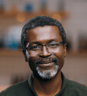 Smiling Nigerian man symbolizing trust, professionalism, and verified digital identity with Profiled Nigeria