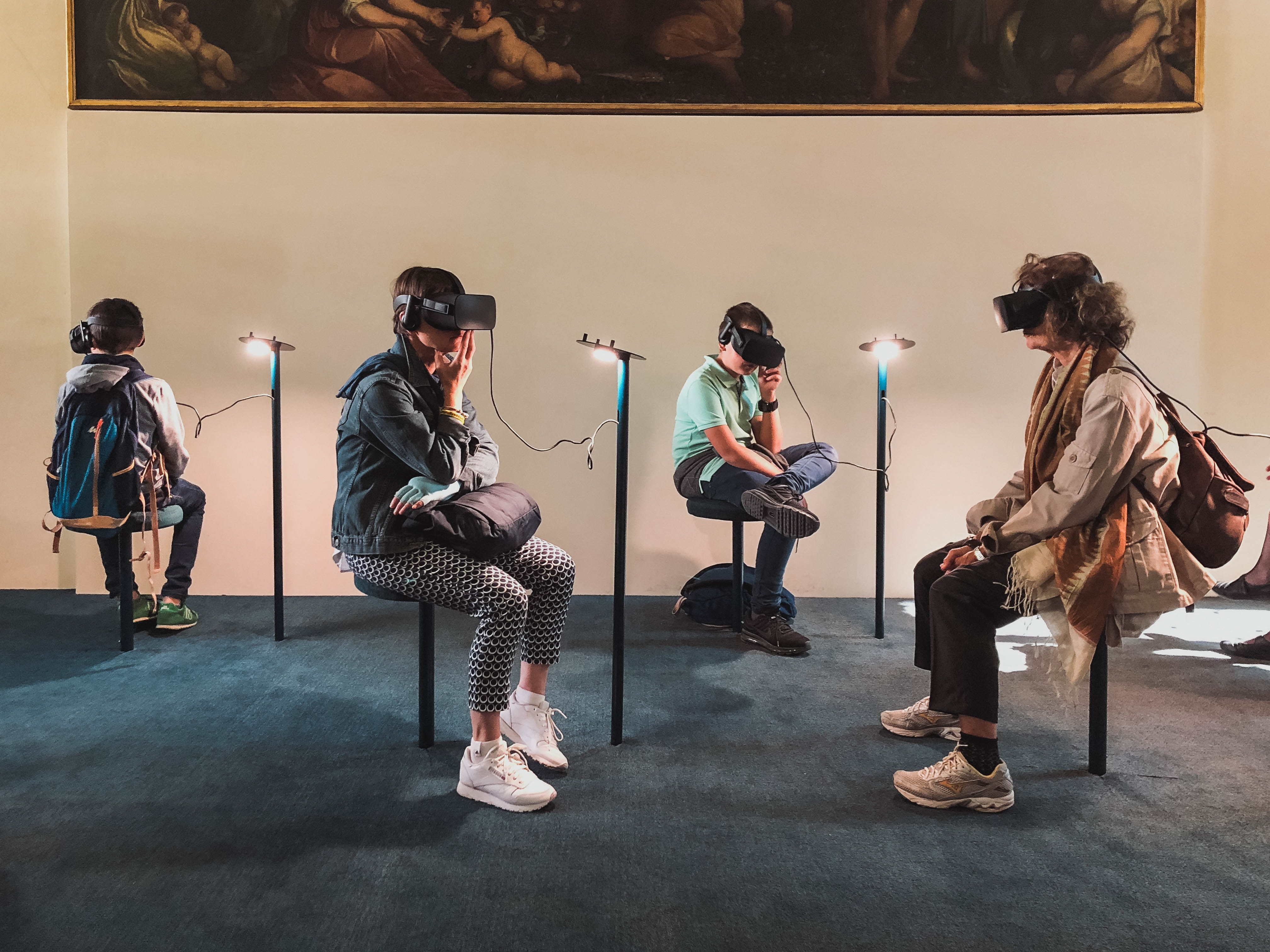 An image of learners sitting on chairs and taking part in VR training. Each learner has a headset on.