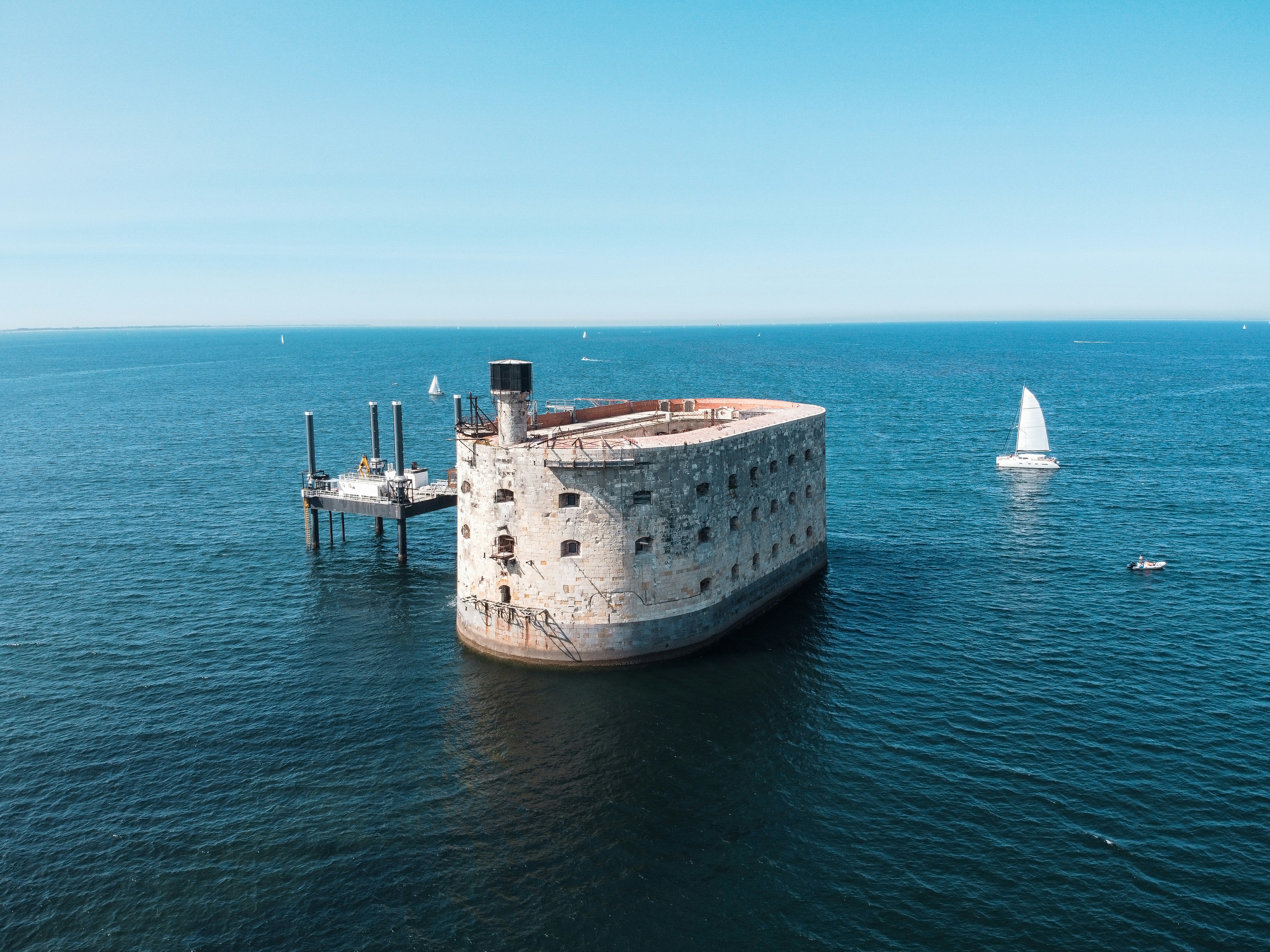 white and brown ship on sea during daytime