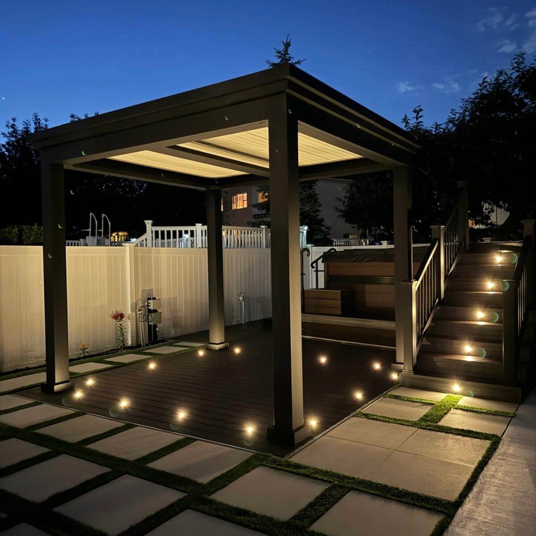 Stunning backyard in ground deck with integrated LED lighting, planters and seating by Jewel Construction Brooklyn NYC