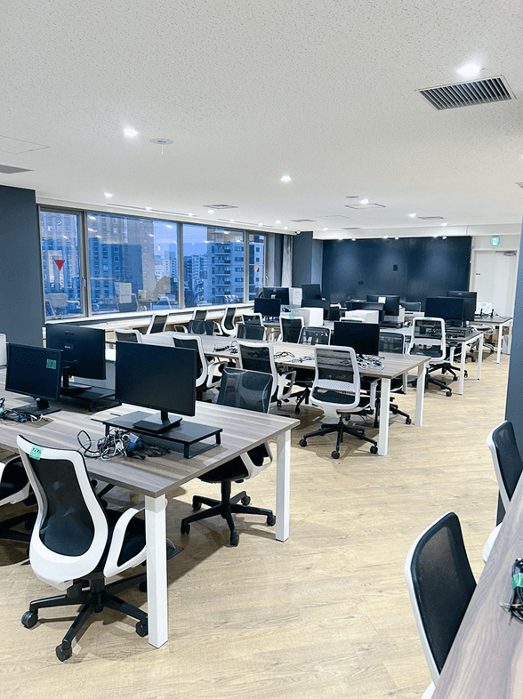 turned off laptop computer on top of brown wooden table