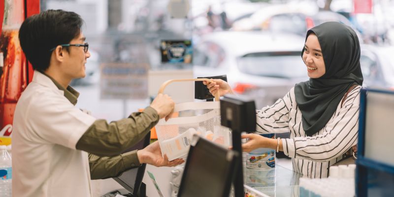 A retail employee assisting a customer