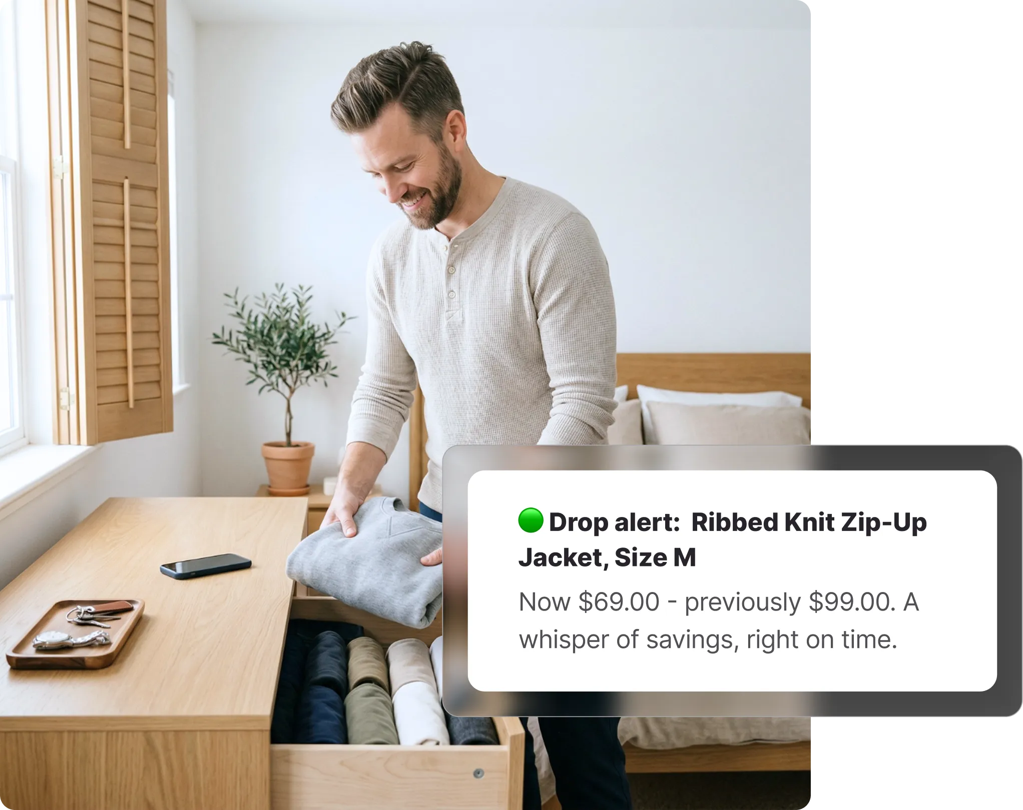 Man folding clothes in a bedroom, with a Whisprice price drop alert showing a Zara Ribbed Knit Zip-Up Jacket dropped from $99 to $69.