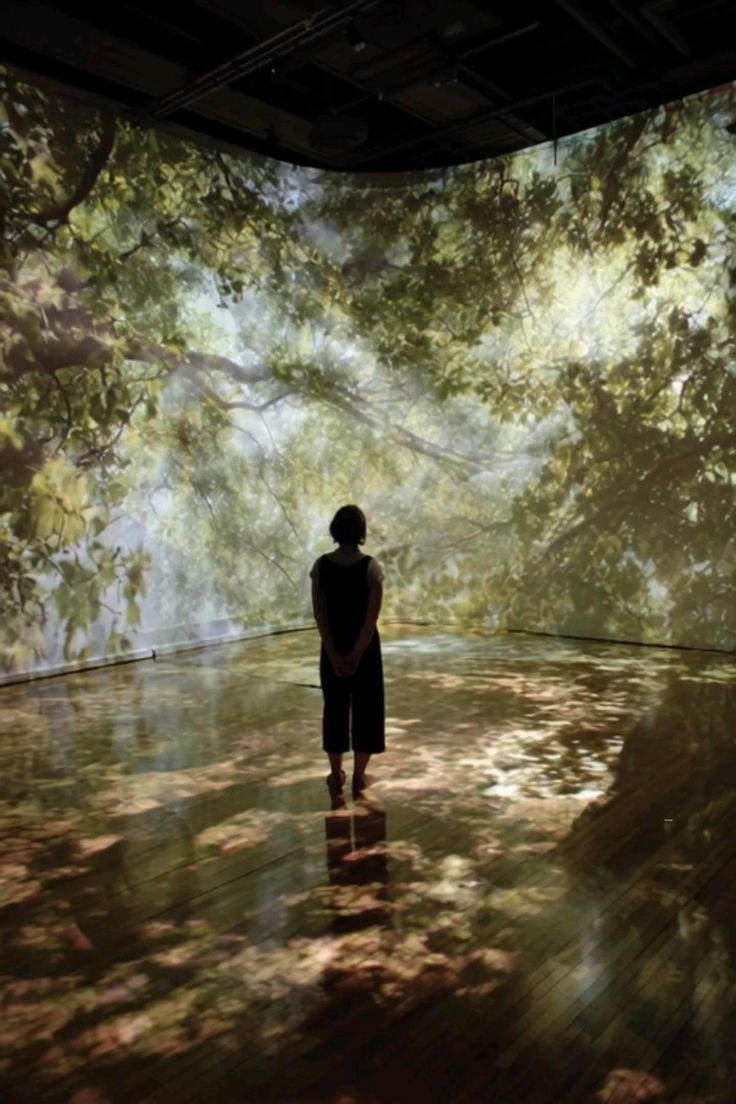a group of women standing on top of a sandy beach
