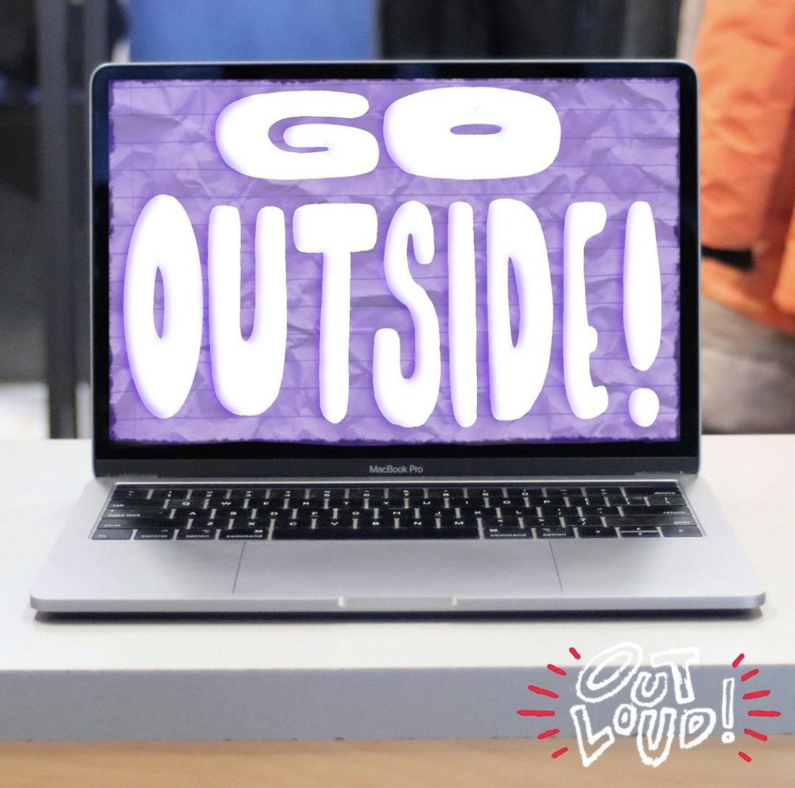 Image of one Instagram post. It shows a laptop screen in a university setting, with the text "Go Outside!" written on top. The project logo is in the bottom right corner.