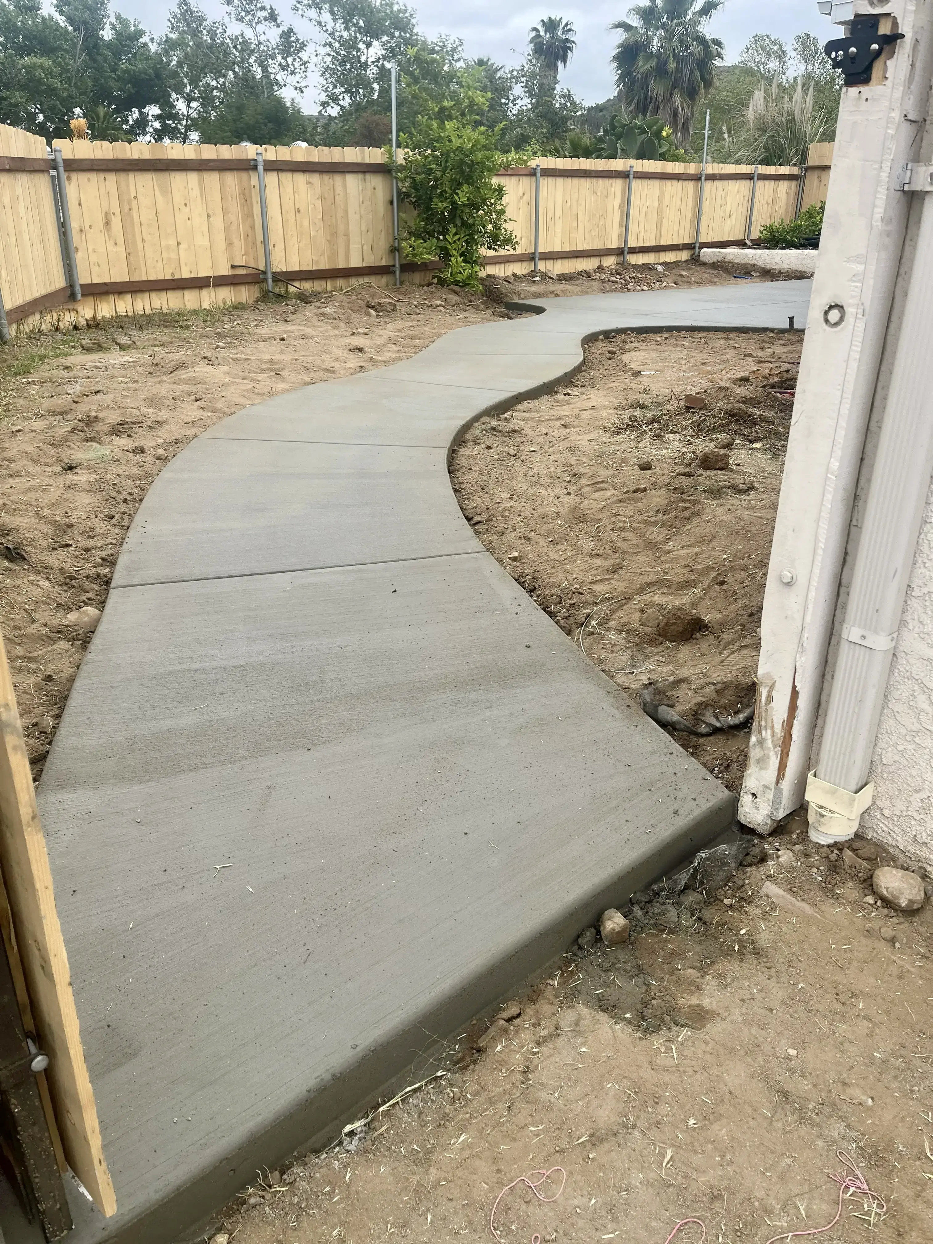 The finished sidewalk from the entry gate