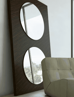 Wooden stand mirror and comfortable armchair