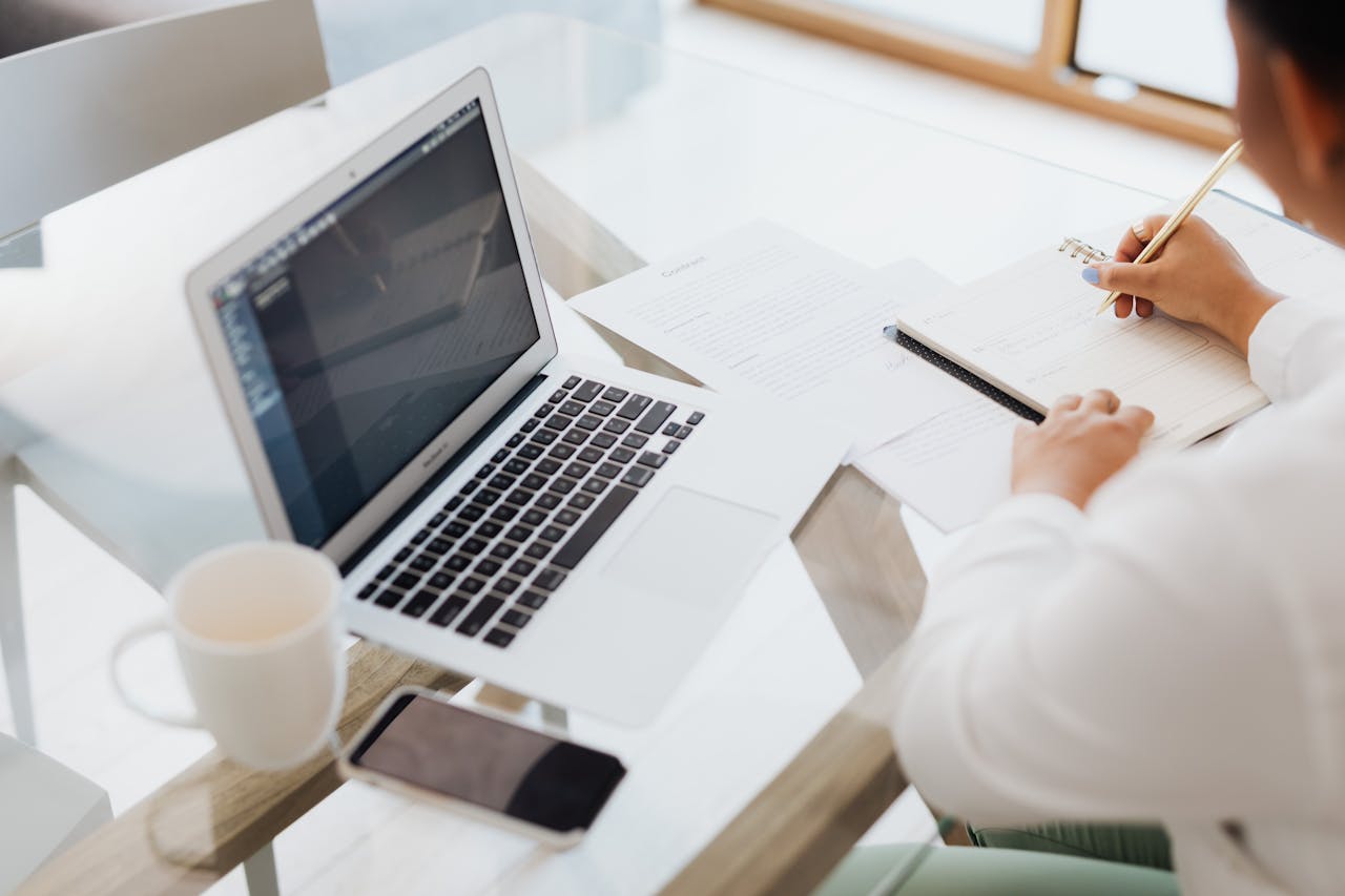 Two palm trees against a clear blue sky