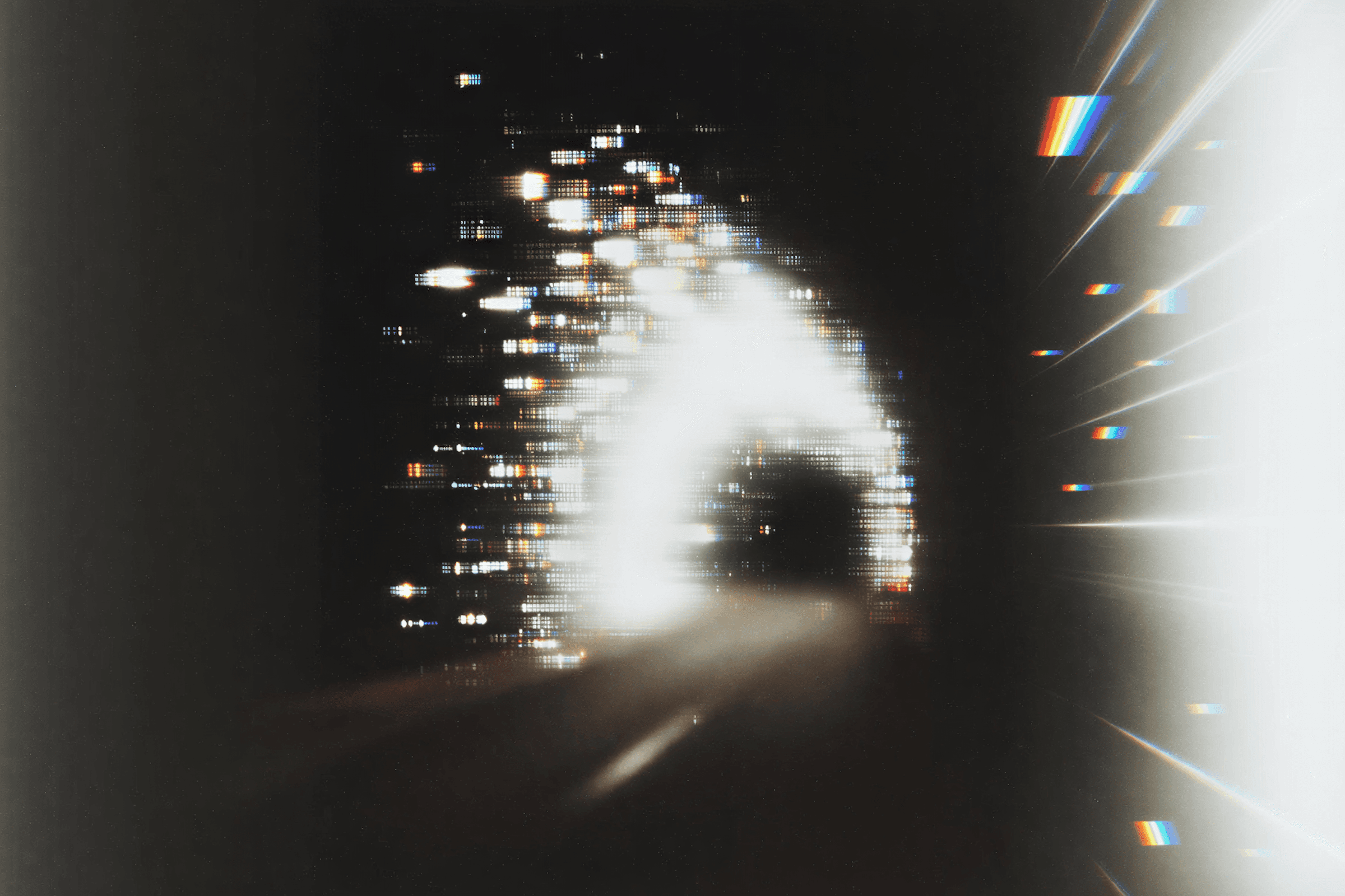 Abstract light tunnel dissolving into fragments —  the moment a brand crosses into a new market  while preserving its core visual identity