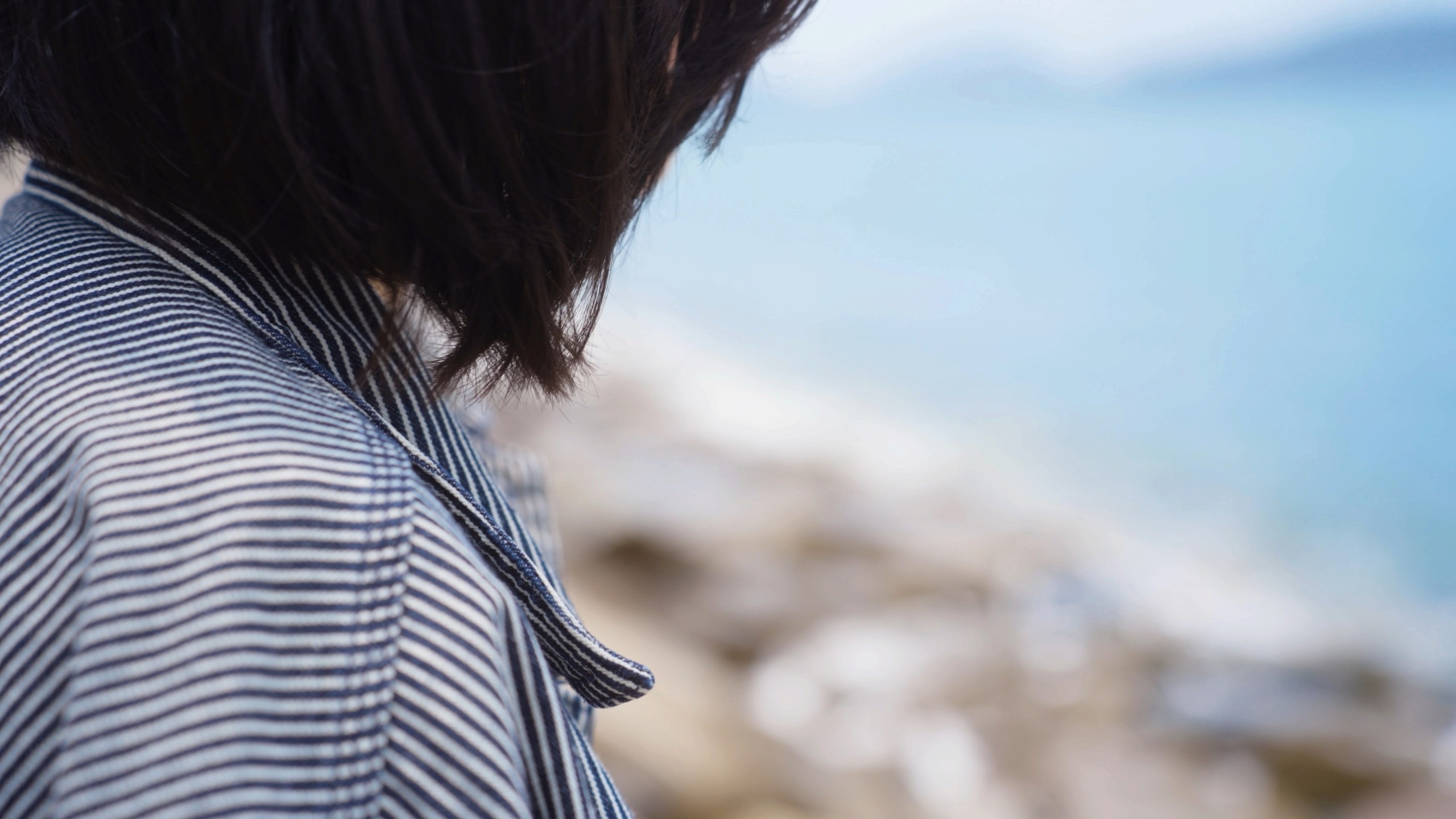 close up of the sister wearing her brother's jacket
