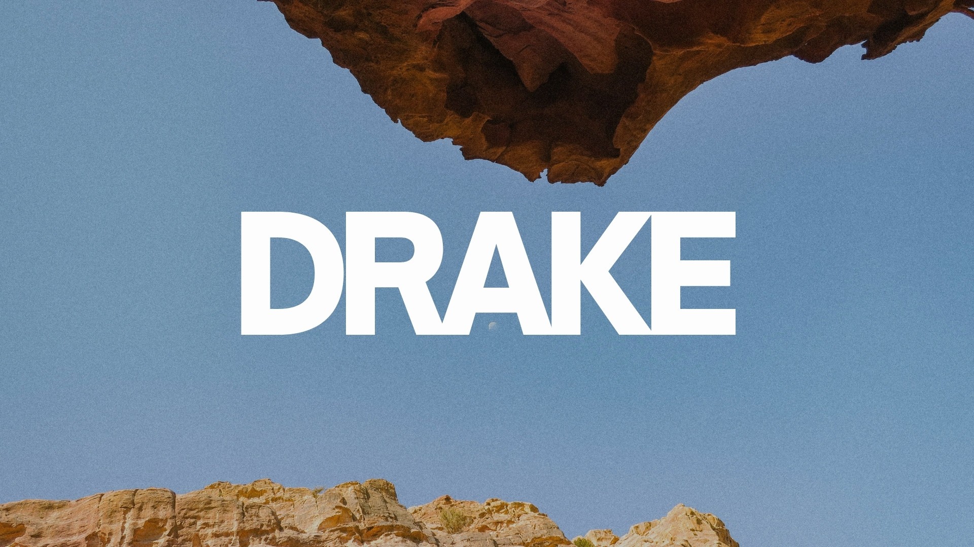 man wearing black sweater riding ATV during cloudy day