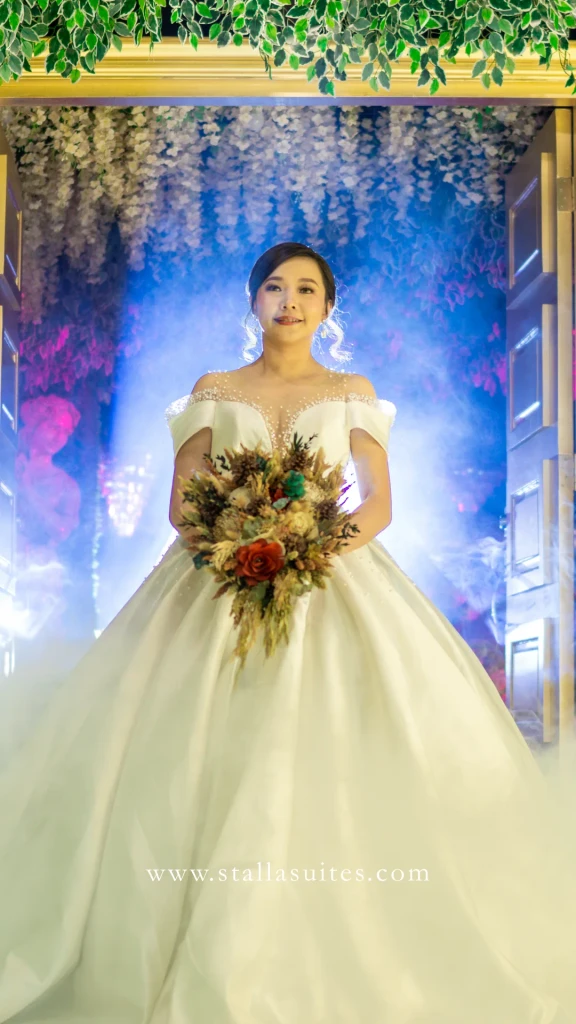 Bride with her bouquet under soft light at Stalla Suites Events Place QC