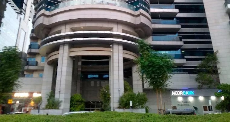 Low angle view of premium office balconies at Grosvenor Commercial Tower in Dubai.